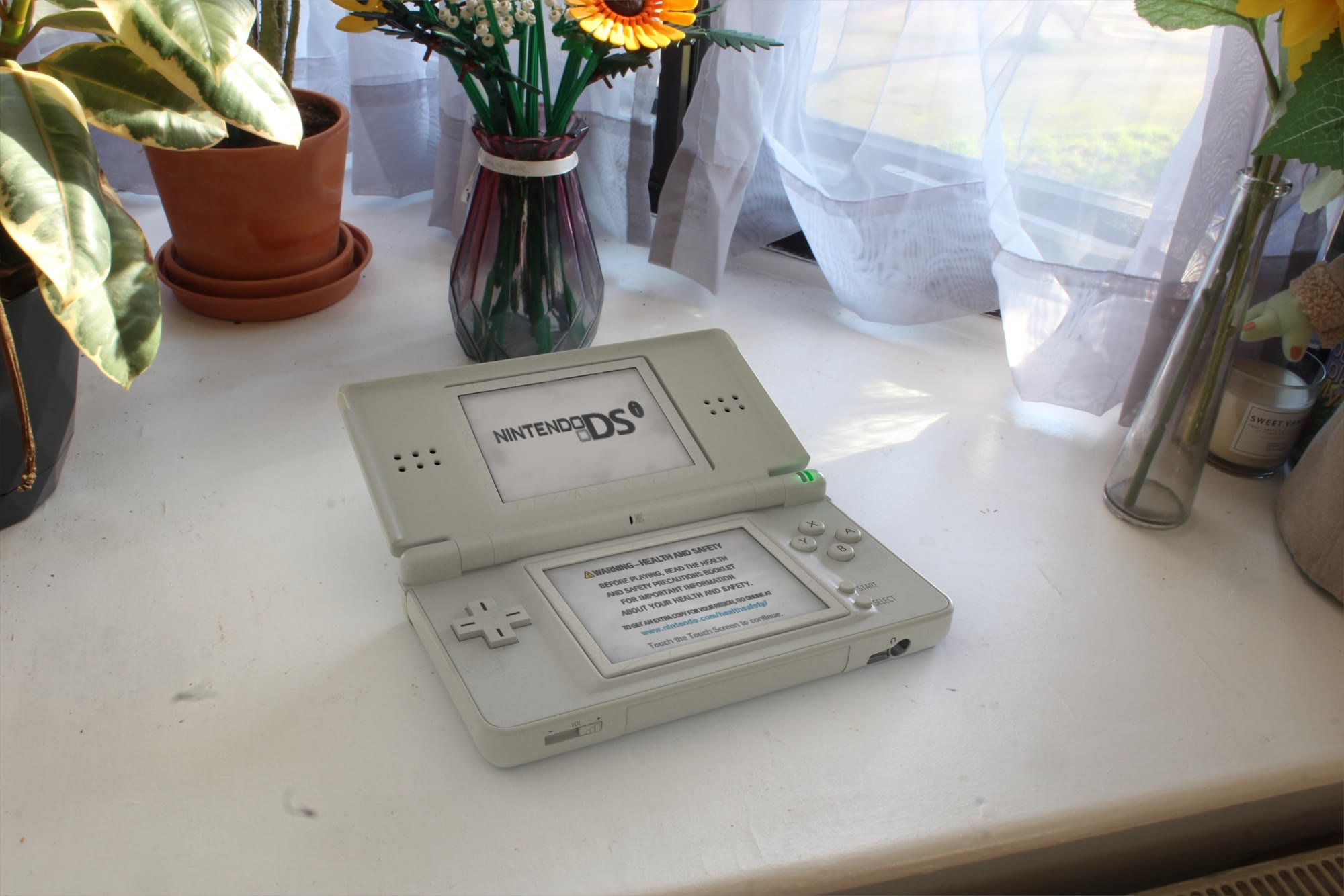 Final render: DS Lite open on a windowsill